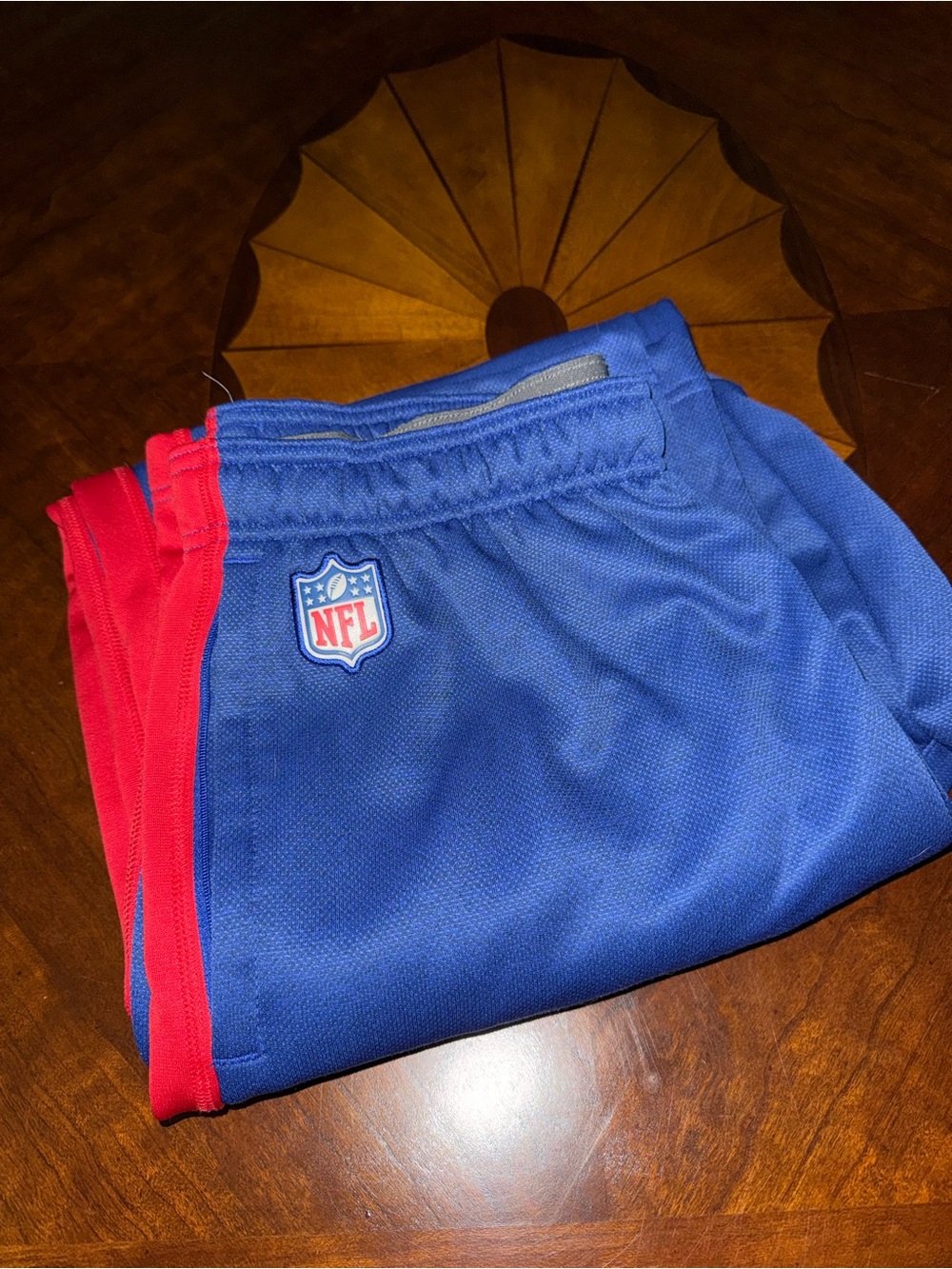 NFL men’s  Blue track pants with Red Side Stripes